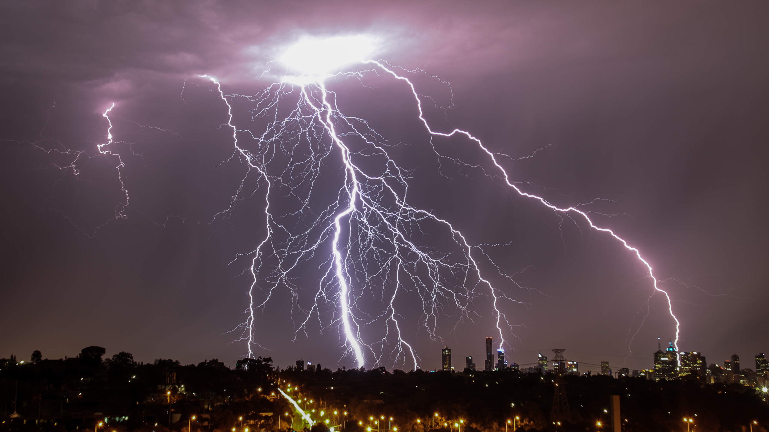 Lightning strikes over Melbourne skyline during thuderstorm